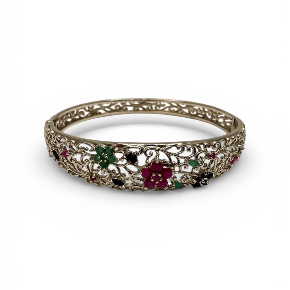 Elegant Gold Bracelet with Red and Green Details